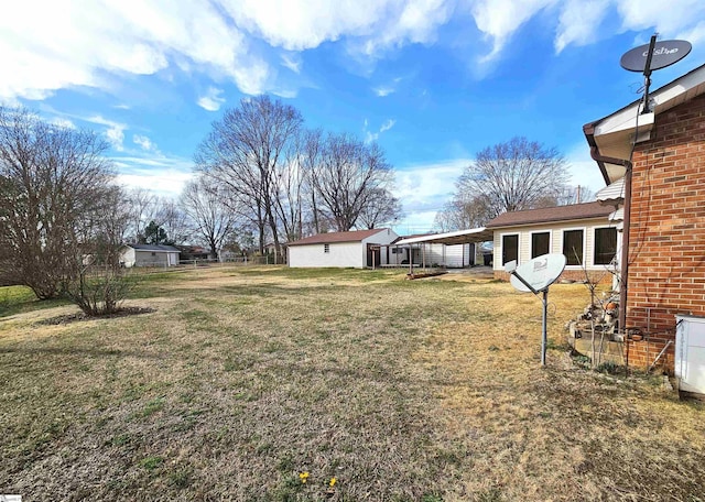 view of yard with a carport