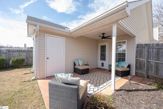 view of patio / terrace featuring ceiling fan and fence