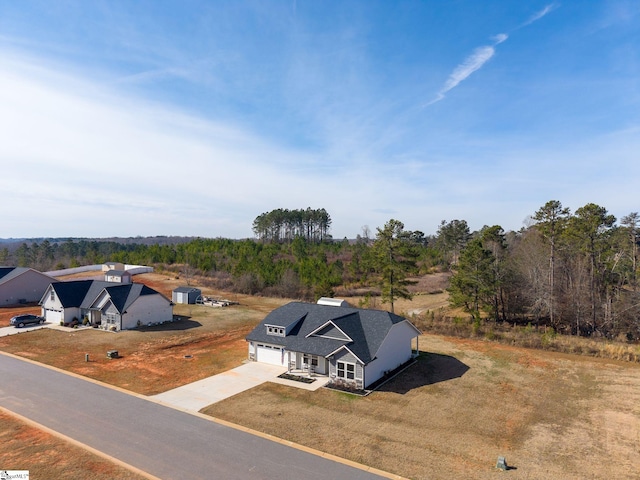 bird's eye view with a forest view