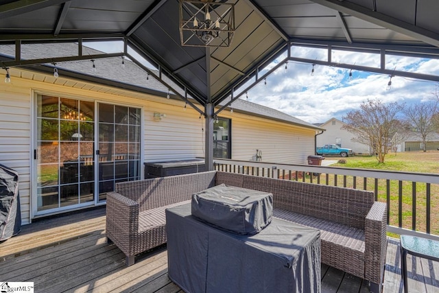 wooden deck featuring outdoor lounge area