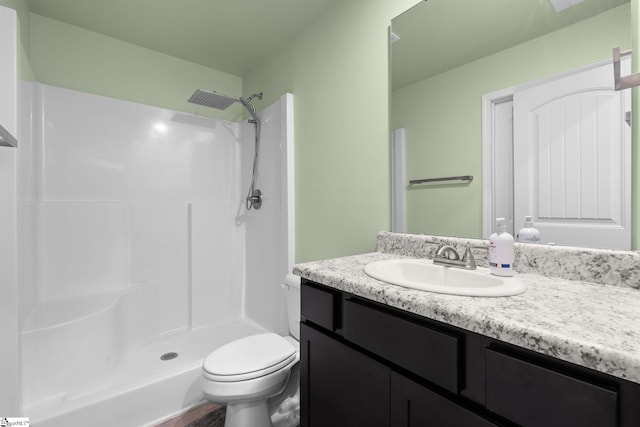 full bath with a shower stall, visible vents, vanity, and toilet