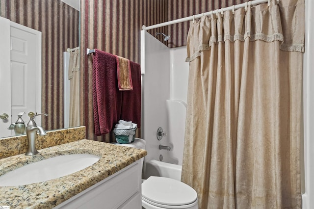 full bath featuring toilet, wallpapered walls, shower / tub combo with curtain, and vanity