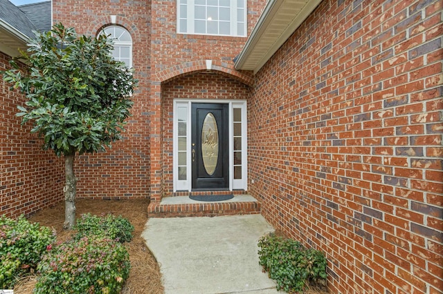 property entrance with brick siding