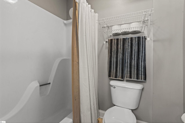 bathroom featuring toilet and shower / bathtub combination with curtain