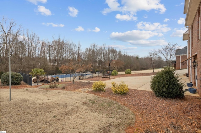 view of yard featuring a patio area and fence