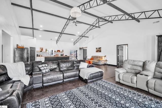 living area with visible vents, high vaulted ceiling, concrete flooring, and beamed ceiling