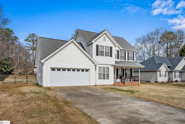 traditional-style home with driveway, a garage, covered porch, fence, and a front lawn