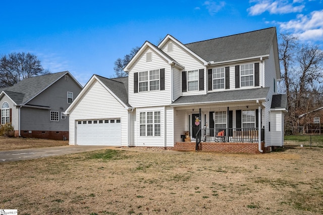 traditional-style home with an attached garage, a porch, concrete driveway, and a front yard