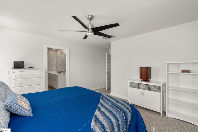 bedroom featuring light colored carpet, a sink, a ceiling fan, baseboards, and visible vents