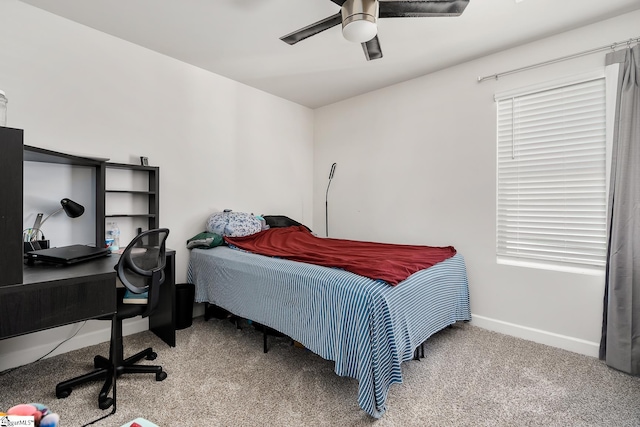 bedroom with light carpet, ceiling fan, and baseboards