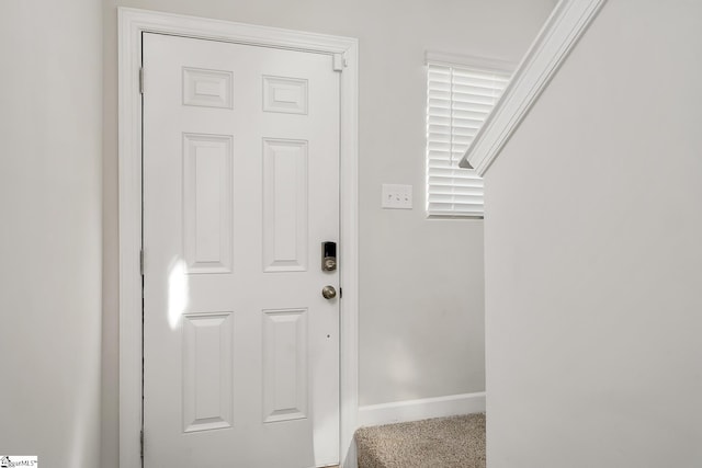 interior space featuring baseboards