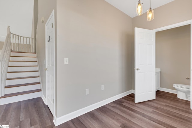 interior space featuring dark wood finished floors and baseboards