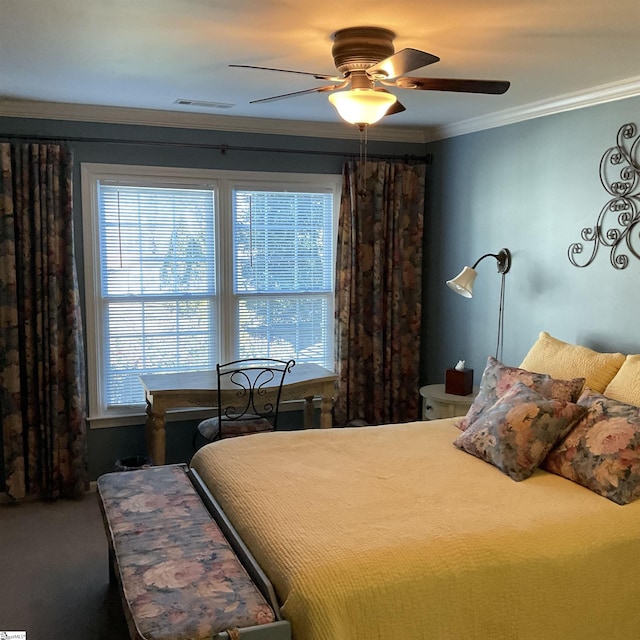 bedroom featuring carpet floors, ornamental molding, visible vents, and a ceiling fan