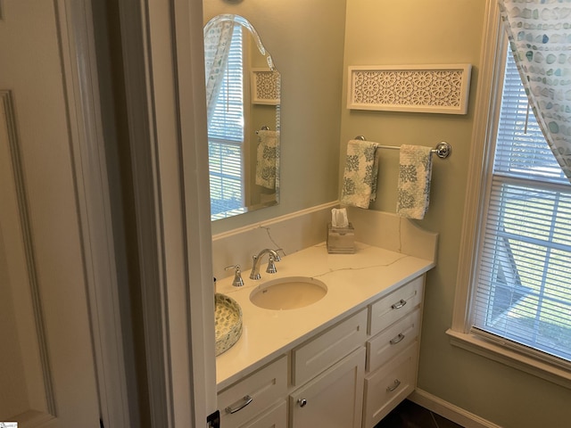 bathroom featuring plenty of natural light and vanity