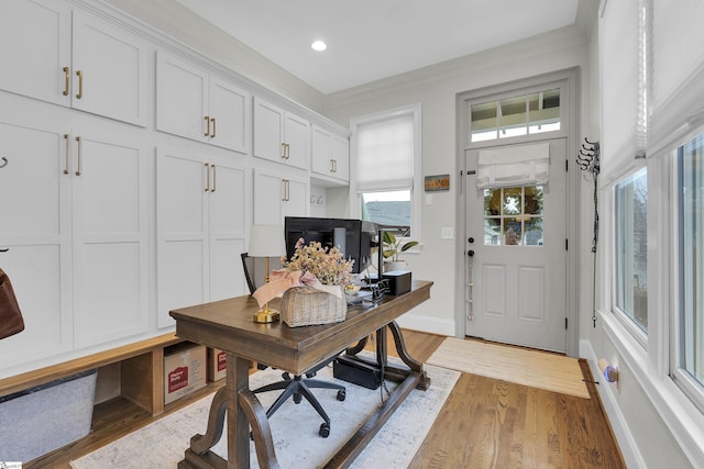 office space with ornamental molding, recessed lighting, baseboards, and wood finished floors