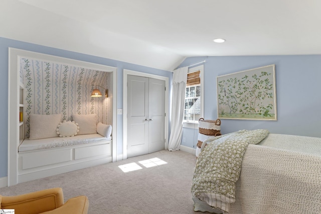 bedroom with recessed lighting, light colored carpet, baseboards, vaulted ceiling, and a closet