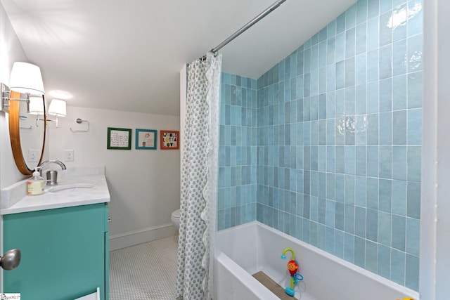 bathroom featuring shower / tub combo with curtain, toilet, vanity, tile patterned flooring, and baseboards