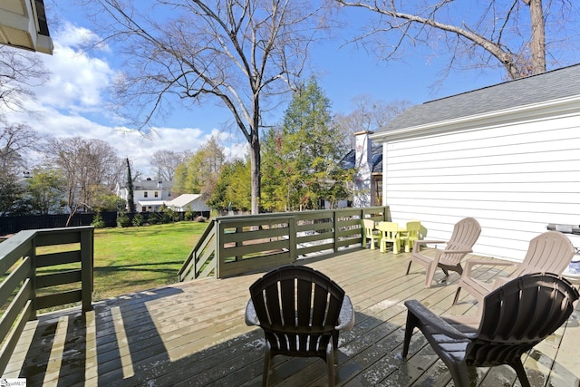 wooden terrace with a yard