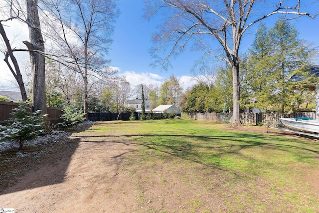 view of yard with a fenced backyard