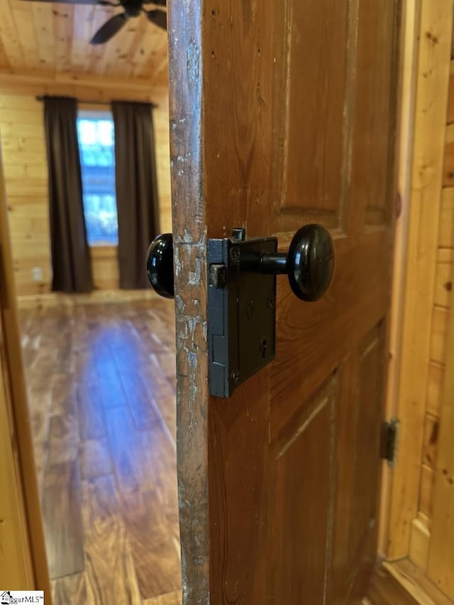 114 Pipe Line Ln, Cleveland, SC 29635 - detailed view of wooden walls, ceiling fan, and wood finished floors