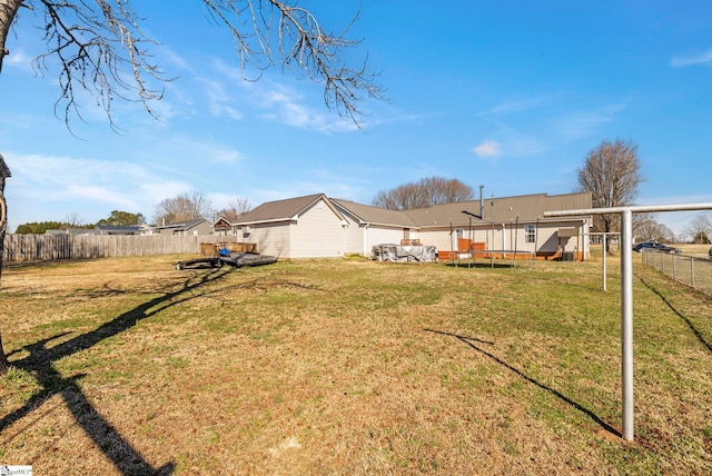 view of yard with a fenced backyard and a wooden deck