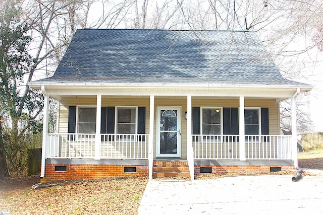 bungalow-style home with crawl space, a shingled roof, and a porch