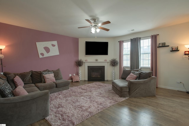 128 Lake Grove Rd, Simpsonville, SC 29681 - living room with ceiling fan, a fireplace with flush hearth, wood finished floors, visible vents, and baseboards
