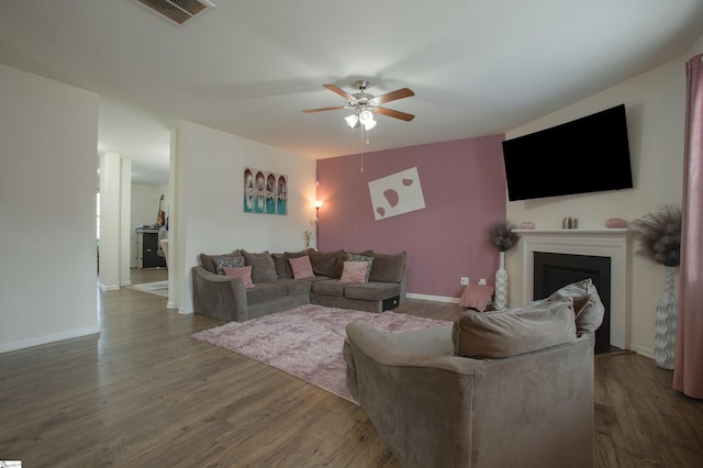 128 Lake Grove Rd, Simpsonville, SC 29681 - living room featuring a fireplace, dark wood finished floors, visible vents, a ceiling fan, and baseboards