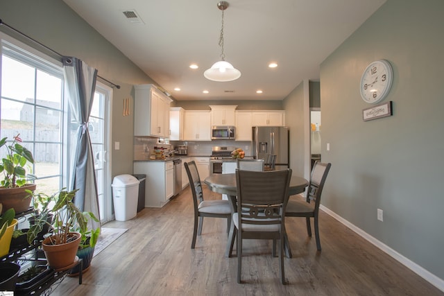 128 Lake Grove Rd, Simpsonville, SC 29681 - dining room with light wood-style flooring, visible vents, baseboards, and recessed lighting