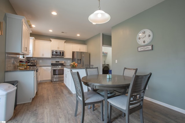 128 Lake Grove Rd, Simpsonville, SC 29681 - dining room featuring recessed lighting, wood finished floors, and baseboards