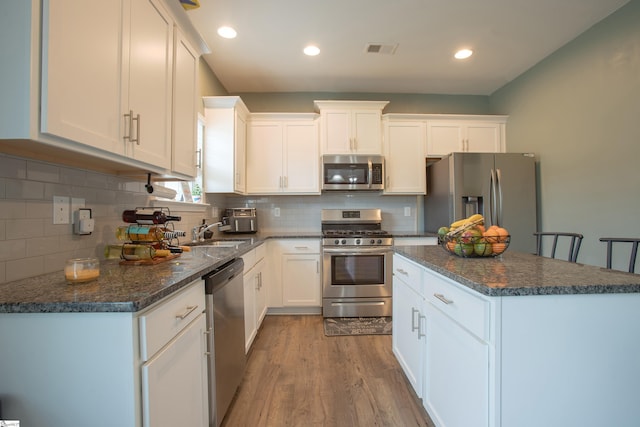 128 Lake Grove Rd, Simpsonville, SC 29681 - kitchen with appliances with stainless steel finishes, white cabinetry, a sink, and visible vents