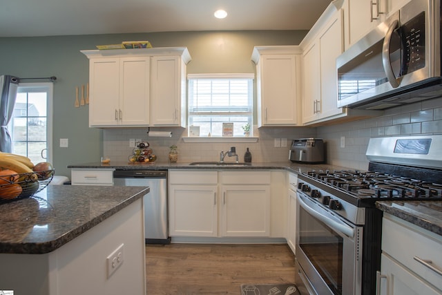 128 Lake Grove Rd, Simpsonville, SC 29681 - kitchen featuring appliances with stainless steel finishes, a sink, and white cabinets