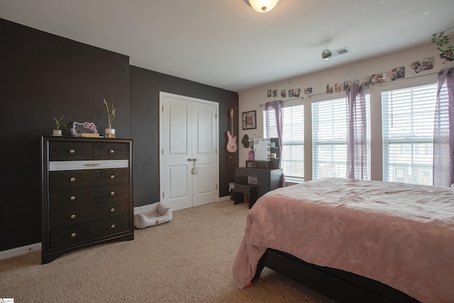 128 Lake Grove Rd, Simpsonville, SC 29681 - bedroom featuring light carpet, baseboards, visible vents, and a closet