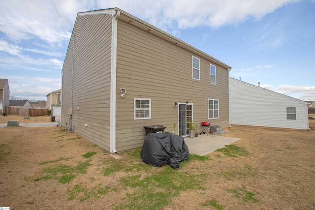 128 Lake Grove Rd, Simpsonville, SC 29681 - rear view of house featuring a lawn and a patio area