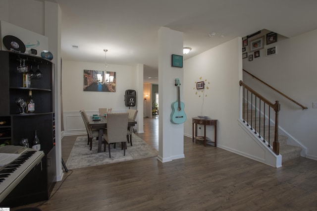 128 Lake Grove Rd, Simpsonville, SC 29681 - dining area with a chandelier, dark wood-style flooring, and stairway