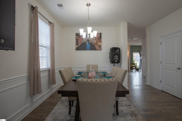 128 Lake Grove Rd, Simpsonville, SC 29681 - dining room featuring dark wood-style flooring, visible vents, a notable chandelier, and wainscoting