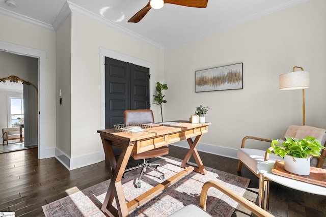 office space with baseboards, ceiling fan, dark wood-style flooring, and crown molding