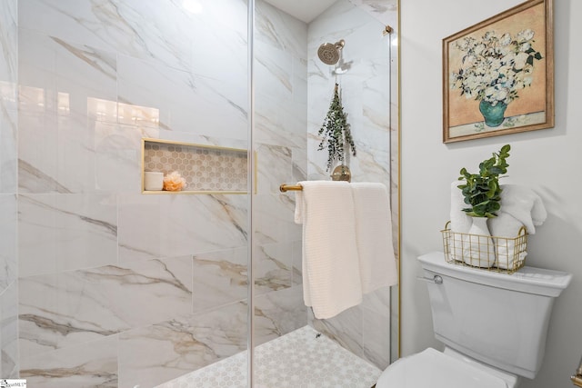 full bath featuring a marble finish shower and toilet