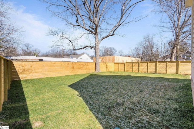 view of yard featuring a fenced backyard