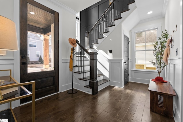 foyer with stairway, recessed lighting, dark wood finished floors, and crown molding