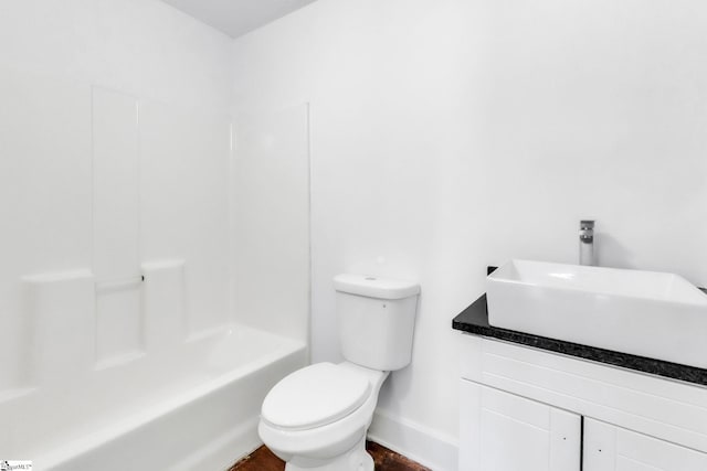 full bath with toilet, bathtub / shower combination, baseboards, and vanity