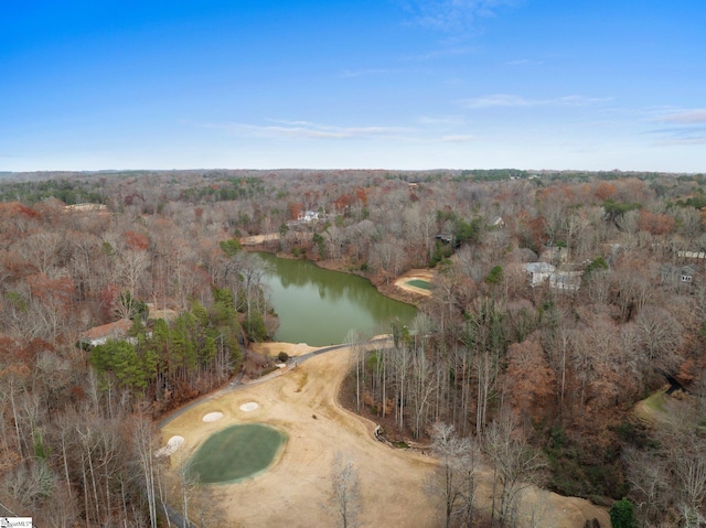 aerial view with a forest view and a water view