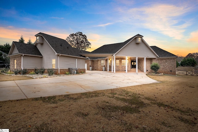 view of front of property with a front yard and brick siding