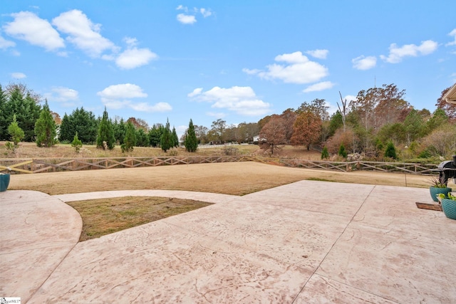 view of yard featuring a patio area and a rural view