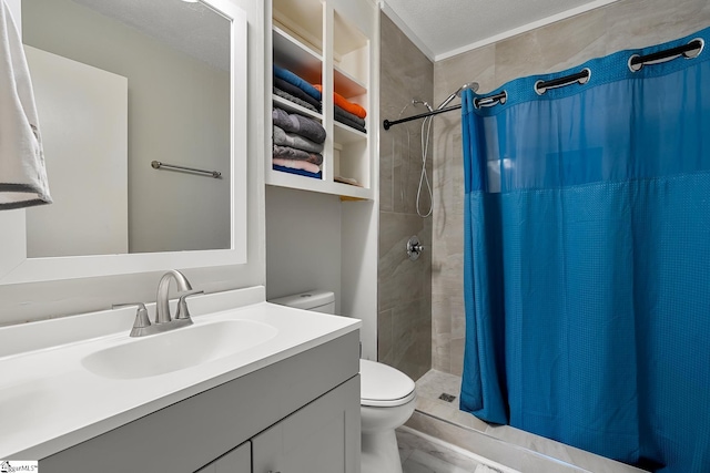 bathroom featuring toilet, a shower stall, and vanity