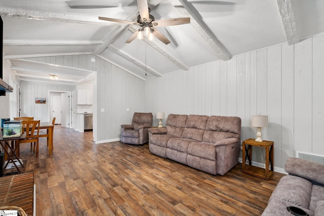 living room featuring dark wood-style floors, visible vents, lofted ceiling with beams, a ceiling fan, and baseboards