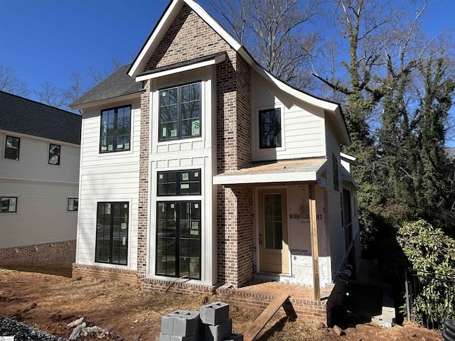 view of front of house featuring brick siding