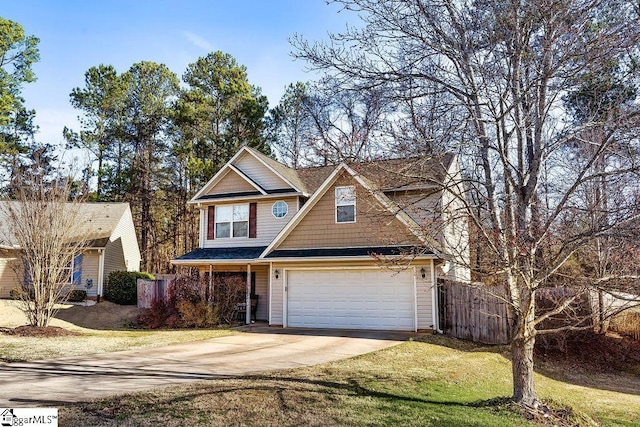 view of front of home featuring driveway, a garage, fence, and a front lawn