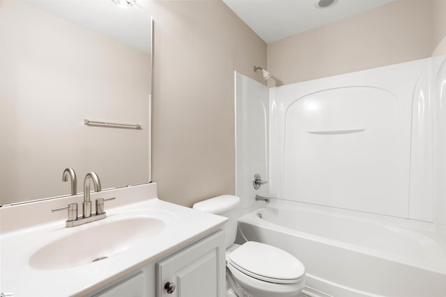 bathroom with shower / tub combination, vanity, and toilet