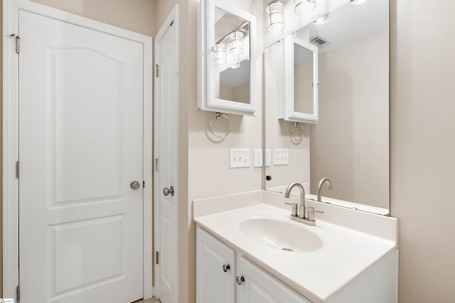 bathroom featuring visible vents and vanity